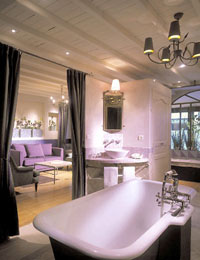 3 person suite with city view, queen bed, and private facilities (bath and shower)